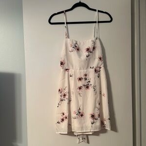 Show Me Your Mumu mini white dress with flowers. Half zipper half tie